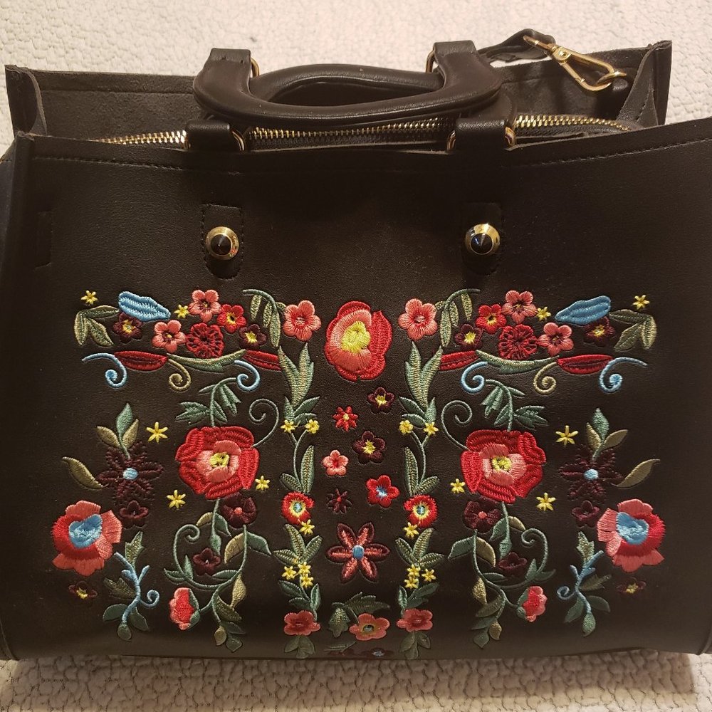 Black purse with flowers